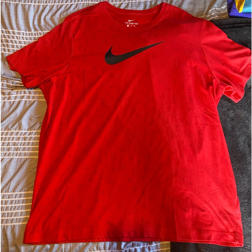 The Nike Tee Dri-Fit  Red Swoosh Logo
